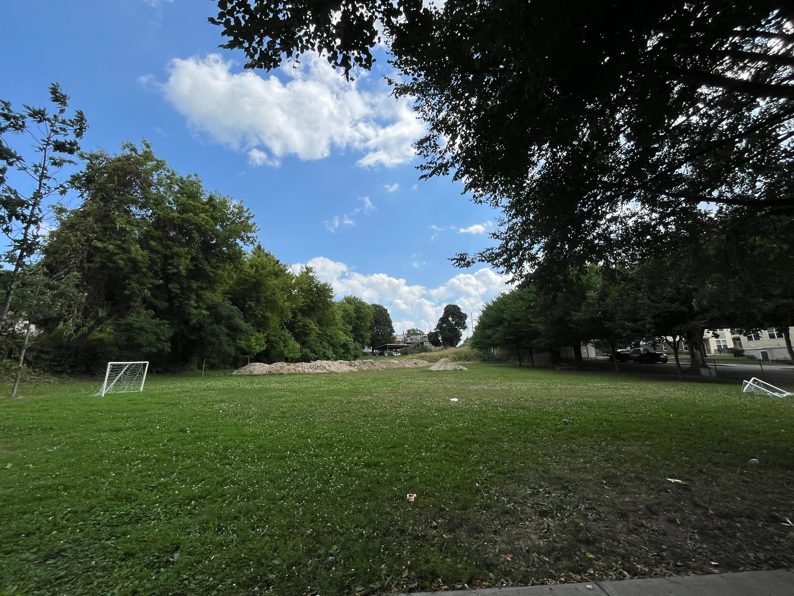 ​Current conditions in park where path will be placed; top soil is currently staged in preparation for grading 